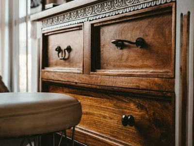 Chest of drawers next to a chair