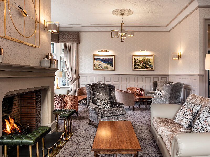 Lounge with a fire at Inn on the Lake in Ullswater