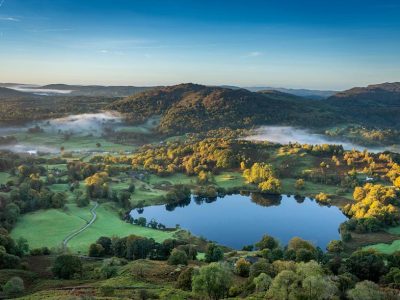 Loughrigg Tarn and the surrounding landscape in Cumbria