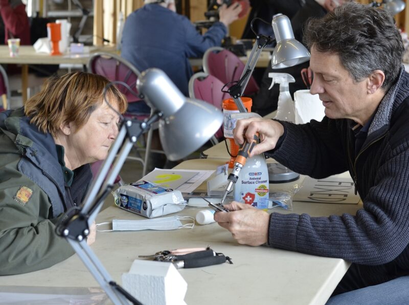 Volunteers repairing items at Penrith Repair Cafe