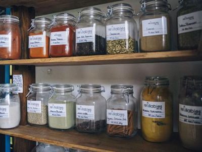 Refillable jars of spices on shelves