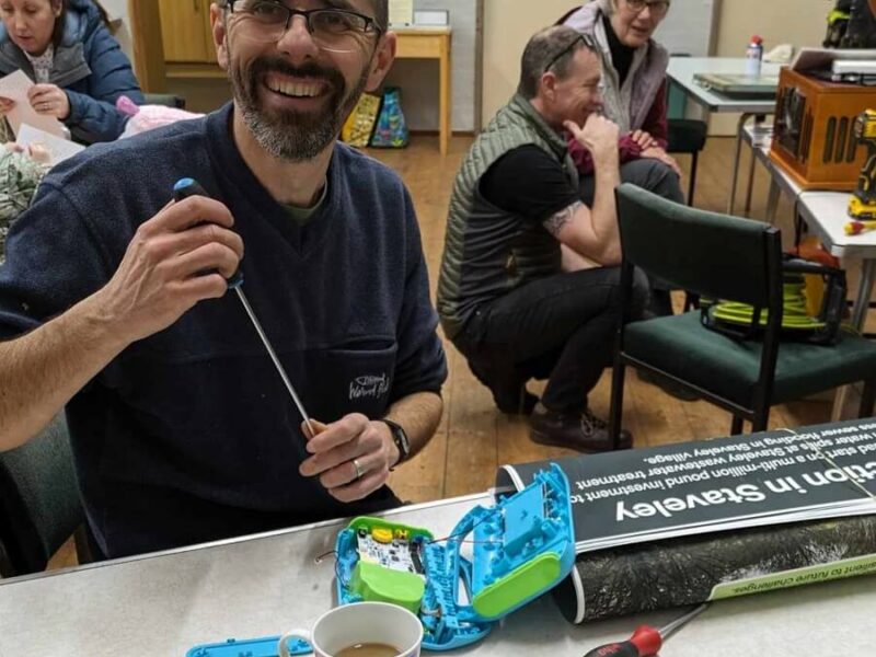 Volunteer repairing items a Staveley Repair Cafe
