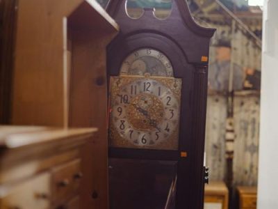 Vintage grandfather clock in a furniture shop